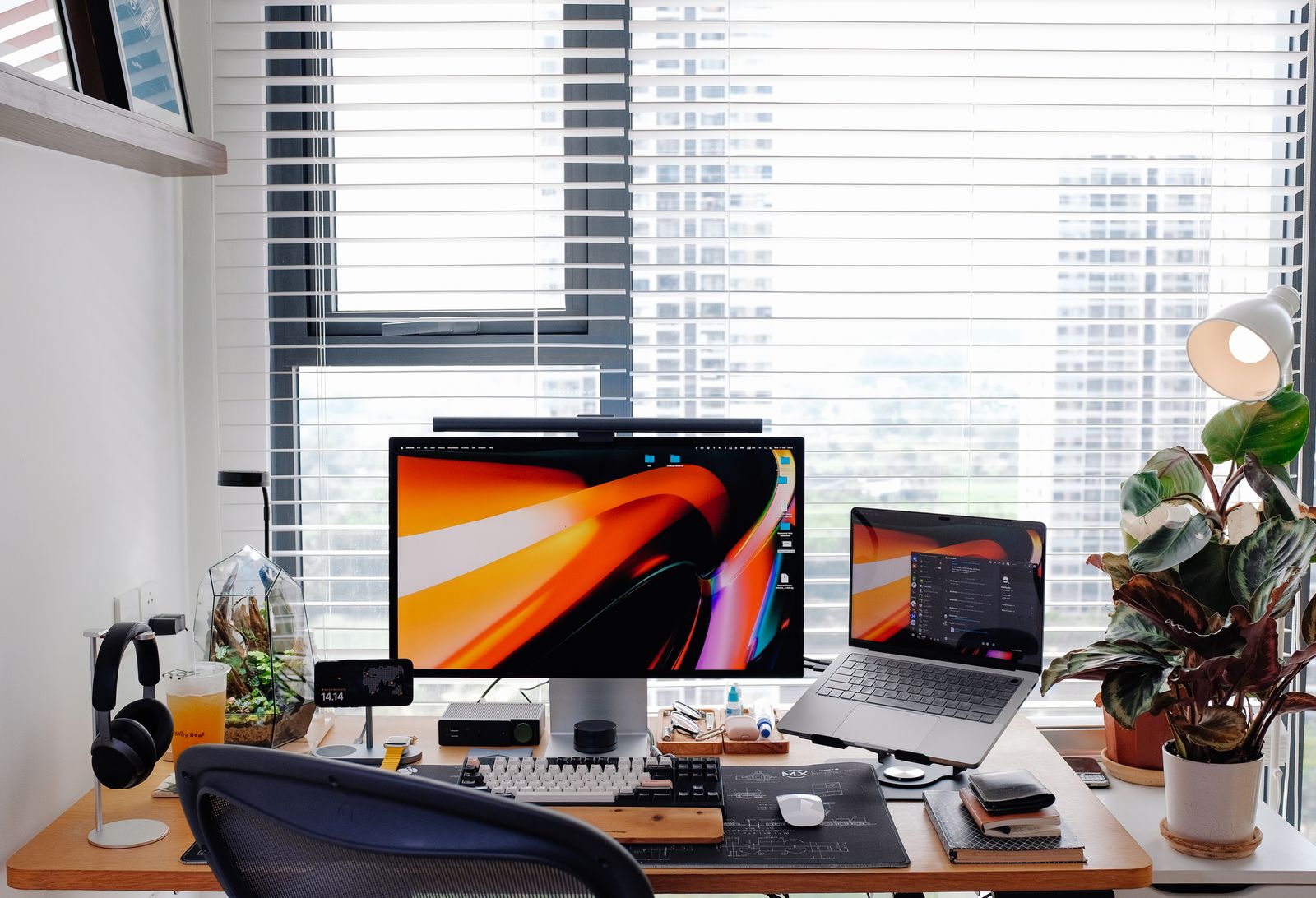 Complete bamboo desk setup with monitor riser, felt mat and tidy cables