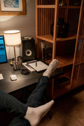 Feet resting comfortably in a cozy home office