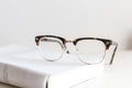 Blue light blocking computer glasses on a desk