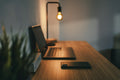 Laptop on a portable lap desk in a casual home setup