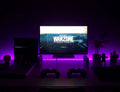 RGB LED strip lighting behind a desk setup at night