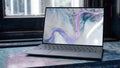 Modern laptop on a cooling stand at clean desk