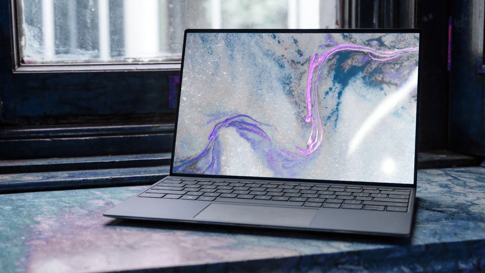Modern laptop on a cooling stand at clean desk